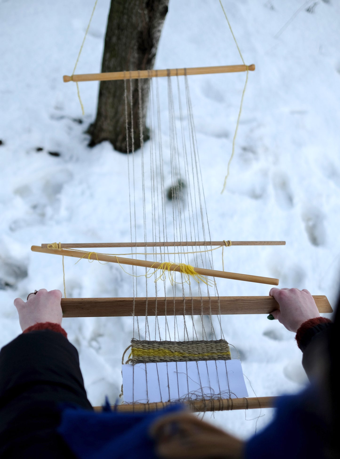 You can weave anywhere on a backstrap loom, even attached to a tree in the middle of winter!